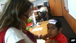 Teacher Karissa Pulido works with students during a summer enrichment session in Santa Ana, California.