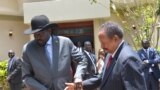 South Sudan's President Salva Kiir (L) and Sudan's Prime Minister Abdalla Hamdok shake hands before meeting in the capital city of Juba, South Sudan, Sept. 12, 2019. 