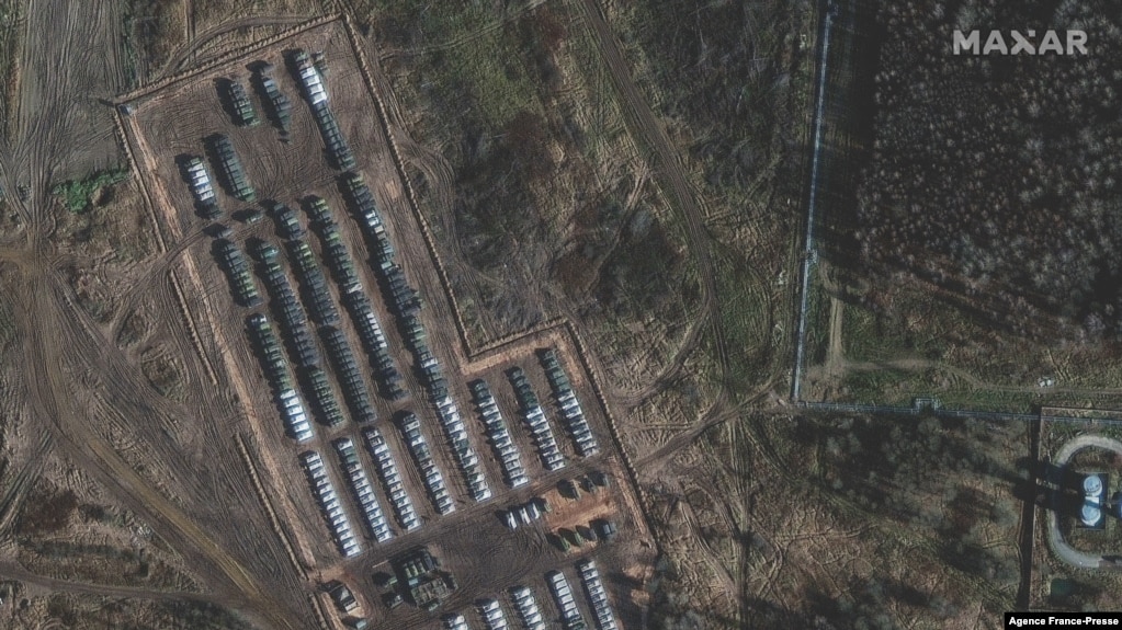 This handout satellite image released by Maxar Technologies and taken on Nov. 1, 2021, shows tanks, armored personnel carriers and support equipment amid the presence of a large ground forces deployment on the northern edge of the town of Yelnya, Smolensk Oblast, Russia.