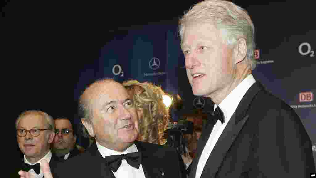 FIFA President Sepp Blatter, left, and former U.S. President Bill Clinton pose prior to the award ceremony of the German "Bambi 2005" media awards in Munich, southern Germany, Thursday, Dec. 1, 2005. Clinton was to receive a "Bambi" prize for his charita