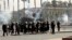Riot police fire tear gas towards supporters of the Muslim Brotherhood during a demonstration at Cairo University, Egypt, May 20, 2014.