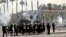 Riot police fire tear gas towards supporters of the Muslim Brotherhood during a demonstration at Cairo University, Egypt, May 20, 2014.