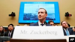 Facebook CEO Mark Zuckerberg arrives to testify before a House Energy and Commerce hearing on Capitol Hill in Washington, Wednesday, April 11, 2018, about the use of Facebook data to target American voters in the 2016 election and data privacy.