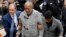 Bill Cosby arrives at court to face a felony charge of aggravated indecent assault on Dec. 30, 2015, in Elkins Park, Pennsylvania.