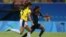 FILE - Colombia's Isabella Echeverri, left, and United States' Crystal Dunn go for the ball during a group G match of the women's Olympic football tournament between Colombia and United States at the Arena Amazonia stadium in Manaus, Brazil, Aug. 9, 2016.