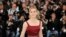 Actress Emma Watson poses for photographers during a photo call for the film The Bling Ring at the 66th international film festival, in Cannes, southern France, May 16, 2013.