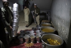 In this Dec. 14, 2019, photo, cooks prepare dinner food for jailed Taliban inside the Pul-e-Charkhi jail in Kabul, Afghanistan.