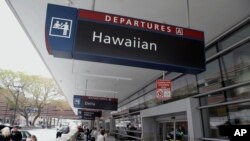 People make their way into Terminal A at Mineta San Jose International Airport near the Hawaiian Airlines gates, April 21, 2014, in San Jose, Calif. Photo Credit: AP 