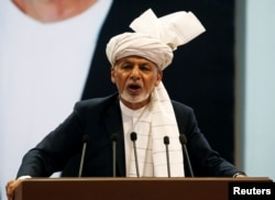 FILE - Afghanistan's President Ashraf Ghani speaks during a consultative grand assembly in Kabul, Afghanistan, April 29, 2019.