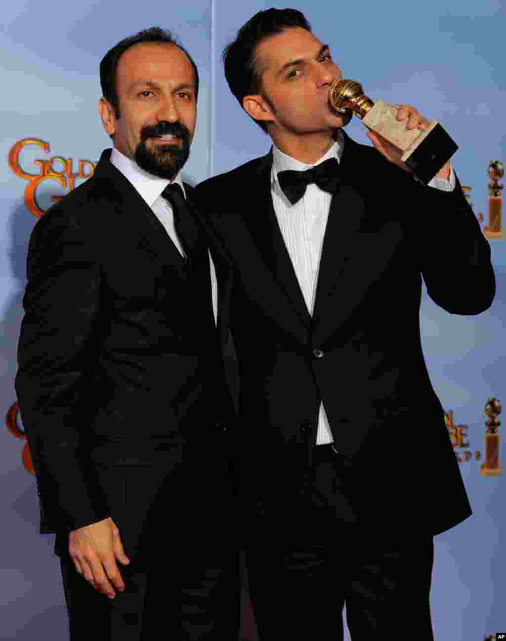 Director Asghar Farhad, left, and actor Peyman Moadi pose backstage with the award for Best Foreign Language Film for "A Separation" during the 69th Annual Golden Globe Awards on January 15, 2012, in Los Angeles. (AP)