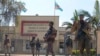 M23 rebels guard outside the South Kivu province administrative office, in the center of the eastern DRC's second-largest city, Bukavu, Feb. 16, 2025.