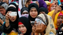 Filipino Muslims join a protest at the Philippine Congress, Feb. 3, 2016, at suburban Quezon city, northeast of Manila, Philippines. 