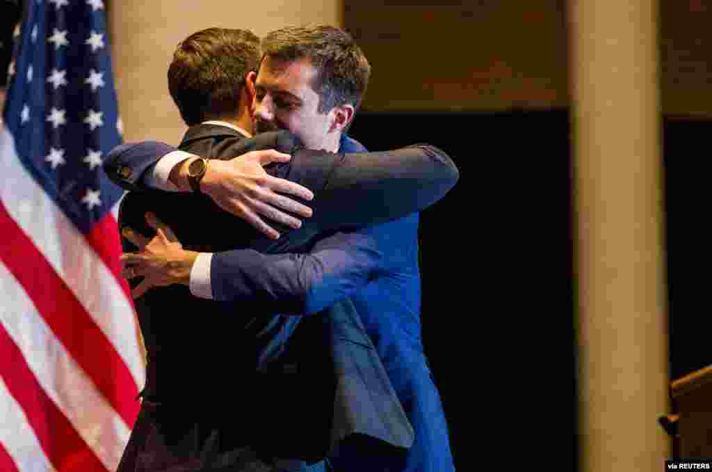 Democratic U.S. presidential candidate Pete Buttigieg hugs his husband Chasten Buttigieg before announcing his withdrawal from the presidential race in South Bend, Indiana, March 1, 2020. (Michael Caterina/South Bend Tribune via USA TODAY NETWORK)