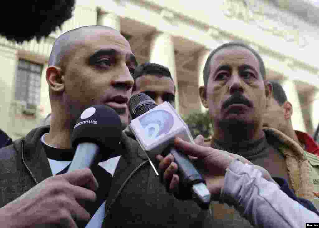 Adel, the brother of Canadian-Egyptian Mohamed Fahmy, one of the journalists working for Al Jazeera television, speaks to the media in front of a court in Cairo, Jan. 1, 2015.