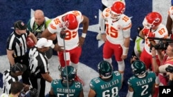 Kansas City Chiefs quarterback Patrick Mahomes (15) watches the coin toss before the NFL Super Bowl 59 football game against the Philadelphia Eagles, in New Orleans, Louisiana, Feb. 9, 2025.