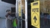 FILE - A man enters a polling station during the federal by-election in Burnaby, British Columbia, Canada, Feb. 25, 2019. A government investigation whose findings were released May 3, 2024, found evidence of foreign meddling in Canada's last two federal elections.