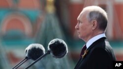 FILE: Russian President Vladimir Putin delivers his speech during the Victory Day military parade in Red square in Moscow, Russia, Monday, May 9, 2022. On June 5, 2023, Moscow said fake Putin messages declaring an emergency were aired on some radio stations . 