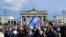 Demonstrators display Israeli flags as they attend a rally in solidarity with Israel in Berlin, Germany on October 22, 2023.
