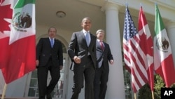 U.S. President Barack Obama, (C), Canada's Prime Minister Stephen Harper (R), and Mexico's President Felipe Calderon (L) walk out of the Oval Office before a joint press conference in the Rose Garden of the White House in Washington, April 2, 2012.