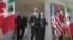 U.S. President Barack Obama, (C), Canada's Prime Minister Stephen Harper (R), and Mexico's President Felipe Calderon (L) walk out of the Oval Office before a joint press conference in the Rose Garden of the White House in Washington, April 2, 2012.