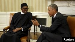 President Barack Obama meets with Nigerian President Muhammadu Buhari (L) in the Oval Office of the White House in Washington July 20, 2015.