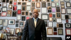 FILE - Congressman John Lewis stands in his office on Capitol Hill, in Washington, May 10, 2007.