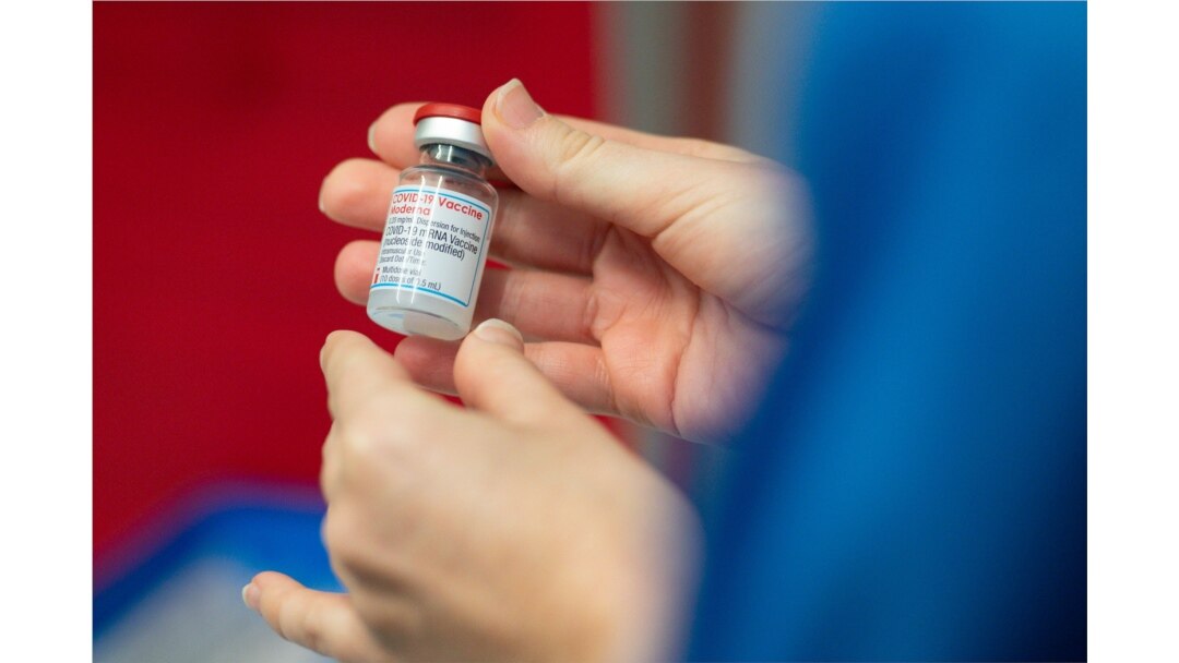 A nurse holds a vial of the Moderna coronavirus disease (COVID-19) vaccine at the Glangwili General Hospital in Carmarthen, Wales, Britain, April 7, 2021. (Jacob King/Pool via Reuters)