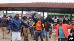 FILE - Activists in eSwatini demanding democratic reforms as they protested at a bus rank, Manzini, October 19, 2021. 