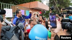 Freddy Meregote, Charge d'affaires at the Venezuelan embassy in Brazil representing Nicolas Maduro's government, gestures as he addresses the media after supporters of opposition leader Juan Guaido left the premises, in Brasilia, Nov. 13, 2019.