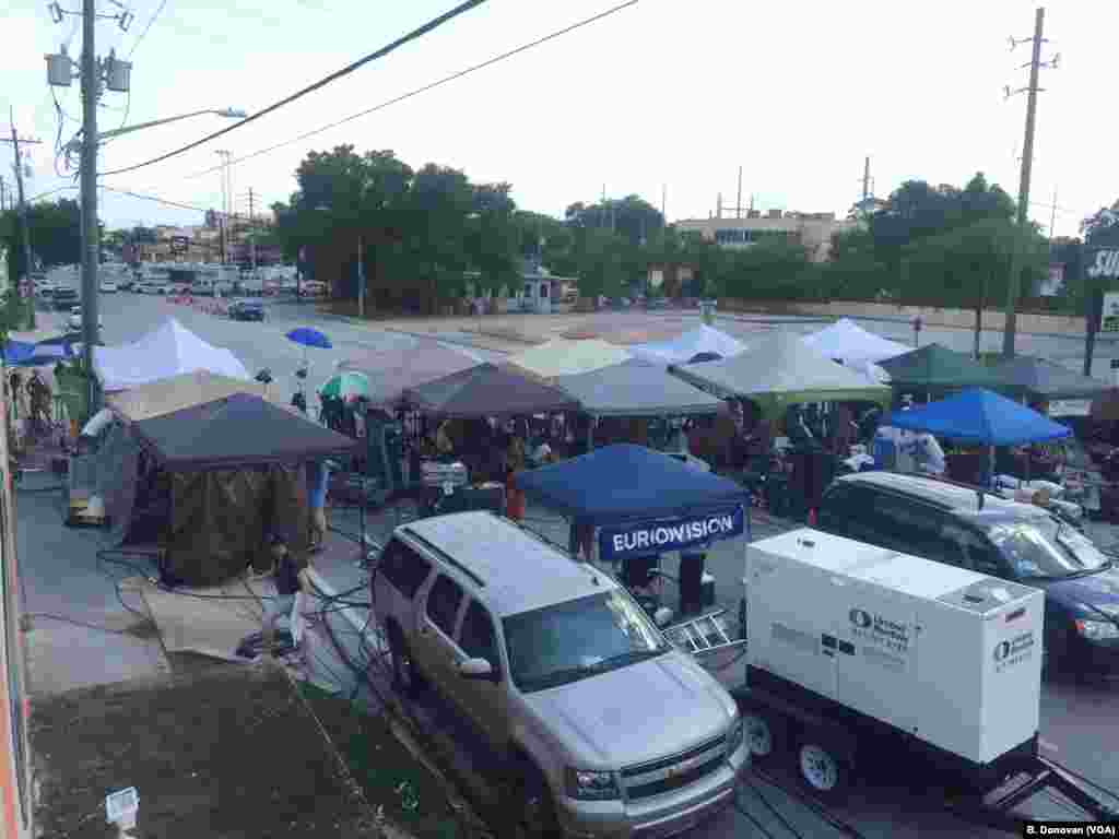 Media tents, foreground, can be seen near the Pulse nightclub in Orlando, Fla., June 14, 2016. Police still have the area cordoned off as they continue their investigation.