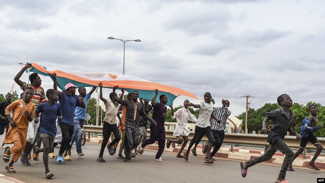 Supporters of Niger's National Council for the Safeguard of the Homeland (CNSP) gather for a demonstration in Niamey on August 11, 2023 near a French airbase in Niger.