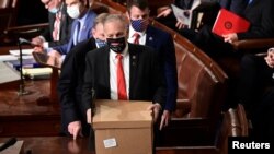 Electoral College ballot boxes arrive to a joint session of the Congress to certify the 2020 election results on Capitol Hill in Washington, Jan. 6, 2021.