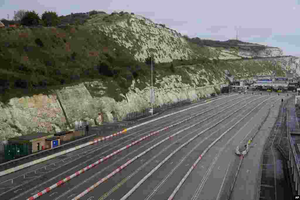 The ferry terminal check-in is seen empty alongside the White Cliffs of Dover, as the Port remains closed, in Dover, England.