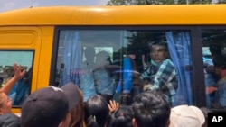 Prisoners released from Insein Prison are welcomed by their colleagues and family members in Yangon, Myanmar April 17, 2023. 