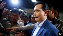 Philippine opposition Senator Antonio Trillanes is escorted to his room following a hastily-called news conference at the Philippines Senate, Sept. 4, 2018, in suburban Pasay city, south of Manila, Philippines.