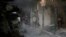 Kashmiri Muslim villagers clean the debris of a house which was damaged in a gunbattle at Shopian, south of Srinagar, Indian controlled Kashmir, Tuesday, Nov. 20, 2018.