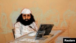 FILE - Walid bin Attash appears at his arraignment as an accused 9-11 co-conspirator in this courtroom sketch reviewed and approved for release by a U.S. military security official, at Guantanamo Bay Navy Base, Cuba, May 5, 2012. 