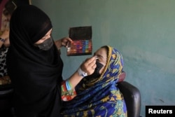 Afghan women attend beautician and makeup class at the Skills Academy for Needy Aspirants, in Peshawar, Pakistan July 13, 2023. (REUTERS/Fayaz Aziz)