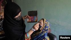 Afghan women attend beautician and makeup class at the Skills Academy for Needy Aspirants, in Peshawar, Pakistan, July 13, 2023