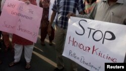 FILE - Human rights activists in Islamabad stage a rally against "honor killings."