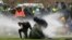 Police use a water canon during a protest against restrictions put in place to curb the spread of the coronavirus, in Amsterdam, Netherlands, Jan. 24, 2021. 