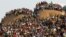 Mining community gathers at a hill dubbed the 'Hill of Horror' during a memorial service for miners killed during clashes at Lonmin's Marikana platinum mine in Rustenburg, 100 kilometers northwest of Johannesburg, South Africa, August 23, 2012.