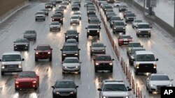 Drivers make their way in the rain along Interstate Highway 95 in Miami, Aug. 30, 2016. Forecasters at the National Hurricane Center in Miami say Tropical Storm Hermine is on a track that would approach the northwest Florida coast Thursday afternoon.