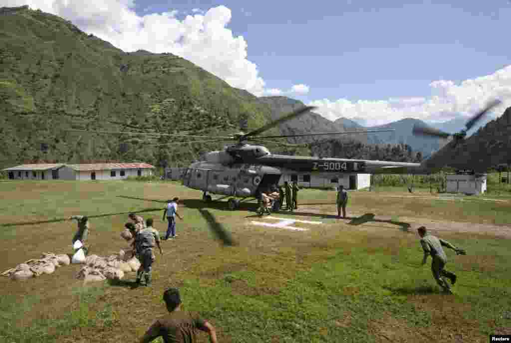 Army soldiers stacking relief materials at an army camp near Reasi, northwest of Jammu, Sept. 9, 2014.