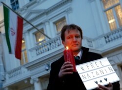 FILE - Richard Ratcliffe, husband of charity worker Nazanin Zaghari-Ratcliffe, imprisoned in Iran, calls for his wife's release, outside the Iranian Embassy in London, Jan. 16, 2017.