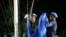 FILE - U.N. peacekeepers lower the U.N. flag during an event marking an end of the Mission of United Nations for the Stabilization in Haiti (MINUSTAH), at the U.N. headquarters in Port-au-Prince, Haiti, Oct. 5, 2017. 