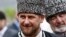 FILE - Chechen leader Ramzan Kadyrov smiles during a government-organized event marking Chechen language day in central Grozny, April 25, 2013.