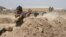 FILE - Iraqi soldiers train with members of the U.S. Army 3rd Brigade Combat Team, 82nd Airborne Division, at Camp Taji, Iraq, in this U.S. Army photo released June 2, 2015. 