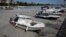 Boats are docked in a small port covered with 'sea snot,' a thick slimy layer of organic matter, also known as marine mucilage, spreading through the Sea of Marmara and posing a threat to marine life, on the shores of Istanbul, Turkey, June 6, 2021. 