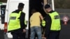 FILE - Police officers check a vehicle during a police operation against immigration, in Biriatou, southwestern France, near the French-Spanish border, on Feb. 18, 2025.